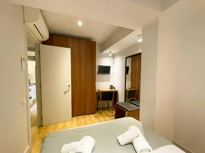 a bedroom with a bed with two towels on it at Boutique Pare Lainez- 2 BR Sagrada Famlia with balcony in Barcelona