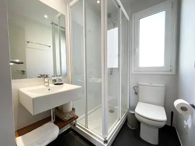 a bathroom with a sink and a shower and a toilet at Boutique Pare Lainez in Barcelona