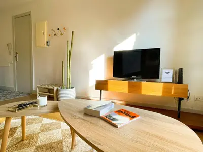 a living room with a tv and a coffee table at Boutique Pare Lainez in Barcelona