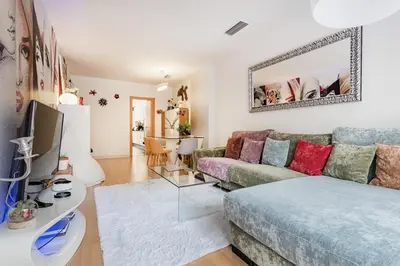 a living room with a couch and a table at Pool LUXURY 2 Bedrooms - 2 Terraces - Parking - Long Term in Barcelona