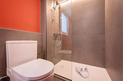 a bathroom with a toilet and a shower at Sweett - Ethnic Eixample in Barcelona