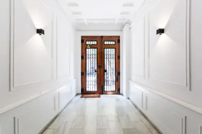 an empty hallway with a door and a tile floor at Sweett - Ethnic Eixample in Barcelona