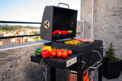 a grill with tomatoes and other vegetables on a table at jacuzzi privado con vistas increíbles el Raco d Artes in Artés