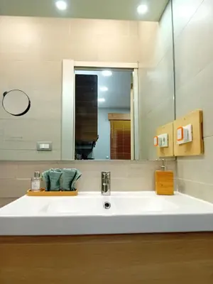 a bathroom with a sink and a large mirror at Bonavista Montgat in Montgat