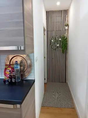 a hallway with a counter and a door to a room at Bonavista Montgat in Montgat