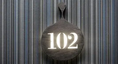 a wooden spoon with the number on it at Hotel Sorli Emocions in Vilassar de Dalt