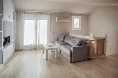 a living room with a couch and a table at Comodidad y estilo en Gava near the beach 10 minutes in Viladecáns