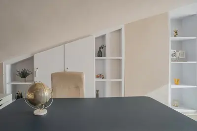 a kitchen with a blue counter top and white shelves at Comodidad y estilo en Gava near the beach 10 minutes in Viladecáns