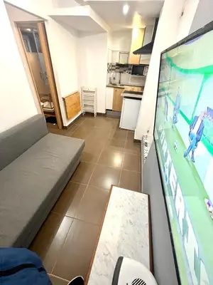 a living room with a tv and a video game at B3 planta baja al lado del metro in Barcelona