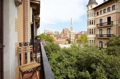 a balcony with a bench on the side of a building at Beautiful apartment in Eixample in Barcelona