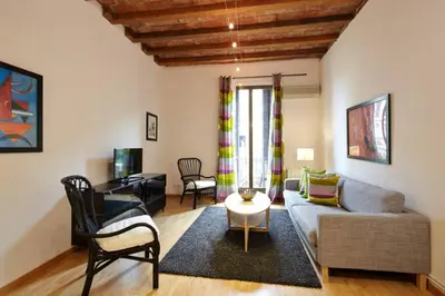 a living room with a couch and a table at Beautiful apartment in Eixample in Barcelona