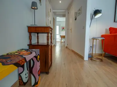 a room with a bed and a table in it at Happy Diamond by Hello Homes Sitges in Sitges