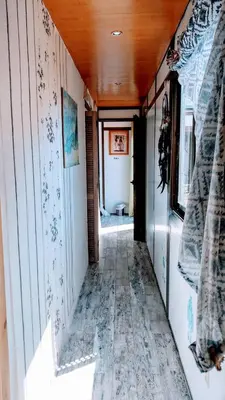a hallway of a home with a tile floor at Atico Soleado in Esplugues de Llobregat