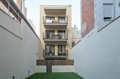 an internal view of an apartment building with a green courtyard at YOUR HOME- Apartment Camp Nou Baj in Hospitalet de Llobregat