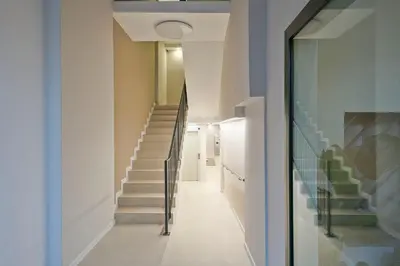 a hallway with stairs in a house at YOUR HOME- Apartment Camp Nou Baj in Hospitalet de Llobregat