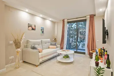a living room with a couch and a table at YOUR HOME- Apartment Camp Nou 1 in Hospitalet de Llobregat