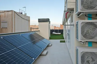 a rooftop with a solar array on a building at YOUR HOME- Apartment Camp Nou 2b in Hospitalet de Llobregat