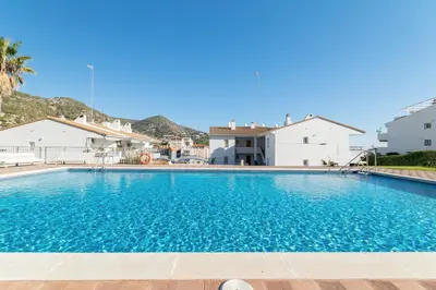 a swimming pool in a villa with a house at Romantic: Precioso frente al mar in Sitges
