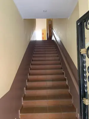 a staircase with brown steps in a building at 1201 - Encantador Apartamento en Poble Nou in Barcelona