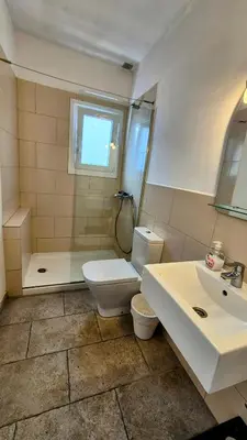 a bathroom with a toilet and a sink at Vila Sitges, big house with pool in Sitges
