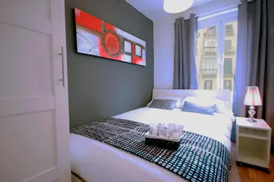a bedroom with a bed with a tray on it at Cosmopolitan in Barcelona