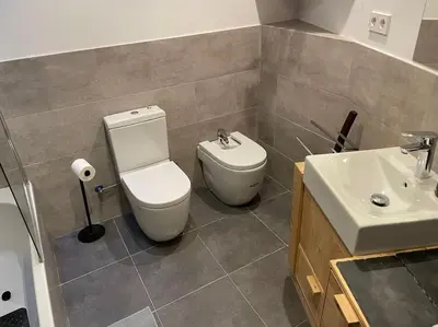 a bathroom with a toilet and a sink at House in Sant Cugat, 25 Mins to Barcelona center in Sant Cugat del Vallès
