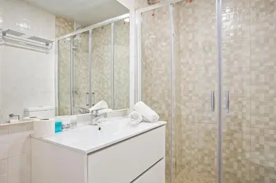 a bathroom with a sink and a shower at Anton's Downtown Apartment in Barcelona