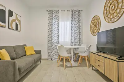 a living room with a couch and a table at Alcam Baro 22 in Barcelona