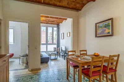 a kitchen and dining room with a table and chairs at 2098 - AB Sagrada Família Bofill in Barcelona