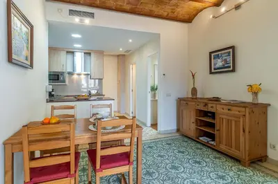 a kitchen and dining room with a table and chairs at 2098 - AB Sagrada Família Bofill in Barcelona