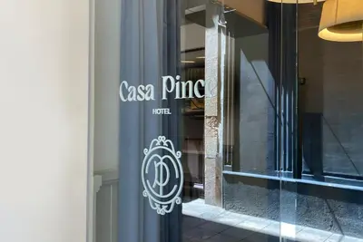 a store window with a casa prima sign on it at Casa Pince in Barcelona