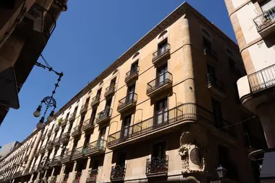 a tall building with balconies on the side of it at Casa Pince in Barcelona