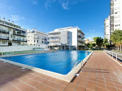 a swimming pool in the middle of a building at Apartment Cortijo Barques by Interhome in Sitges