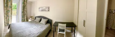 a bedroom with a bed and a table and a chair at Puig comfort in Calella