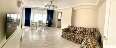 a living room with a couch and a dining room at Puig comfort in Calella