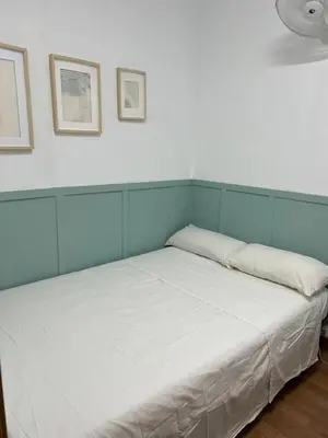 a bed with two pillows on it in a room at Apartamento Villa Caracol in Cunit