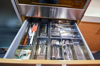 a drawer with silver utensils in a kitchen at Touch the Sky in Hospitalet de Llobregat