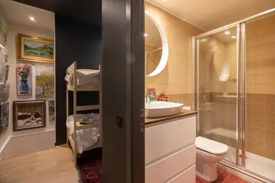 a bathroom with a sink and a toilet at En Ville Boutique Apartments Tamarit in Barcelona