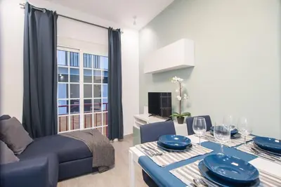 a living room with a dining table and a couch at Dega Sagrada Familia in Barcelona