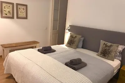 a bedroom with a bed with two towels on it at Beautiful apartment in C/Sepulveda in Barcelona