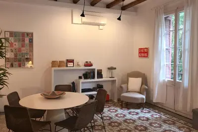 a living room with a table and chairs at Beautiful apartment in C/Sepulveda in Barcelona