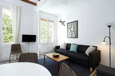 a living room with a couch and a table at Beautiful apartment in C/Sepulveda in Barcelona