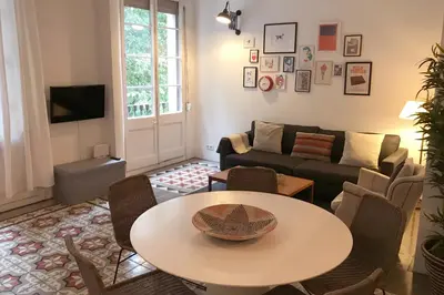 a living room with a table and a couch at Beautiful apartment in C/Sepulveda in Barcelona