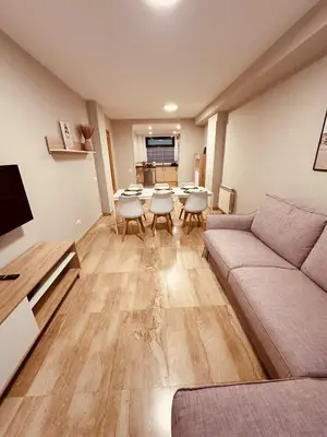 a living room with a couch and a table and chairs at DOLCE GAVA - Estación TREN in Gavà