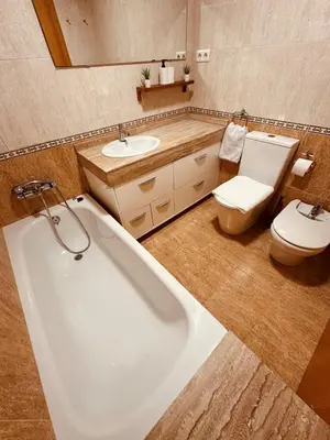 a bathroom with a tub and a toilet and a sink at DOLCE GAVA - Estación TREN in Gavà