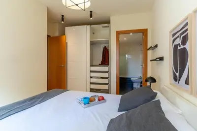 a bedroom with a bed with a bowl of fruit on it at AB Sagrada Familia - Sant Pau in Barcelona