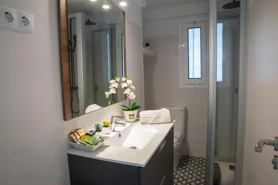 a bathroom with a sink and a mirror at Wonderful apartment in Gavà. Barcelona in Gavà