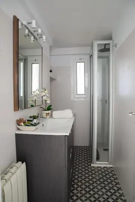 a bathroom with a sink and a mirror at Wonderful apartment in Gavà. Barcelona in Gavà