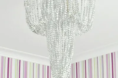 a chandelier hanging from a ceiling in a room at Chic & Cheap in Barcelona