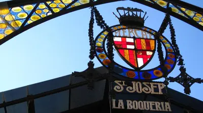 a stained glass sign hanging from a la bookstore at Chic & Cheap in Barcelona